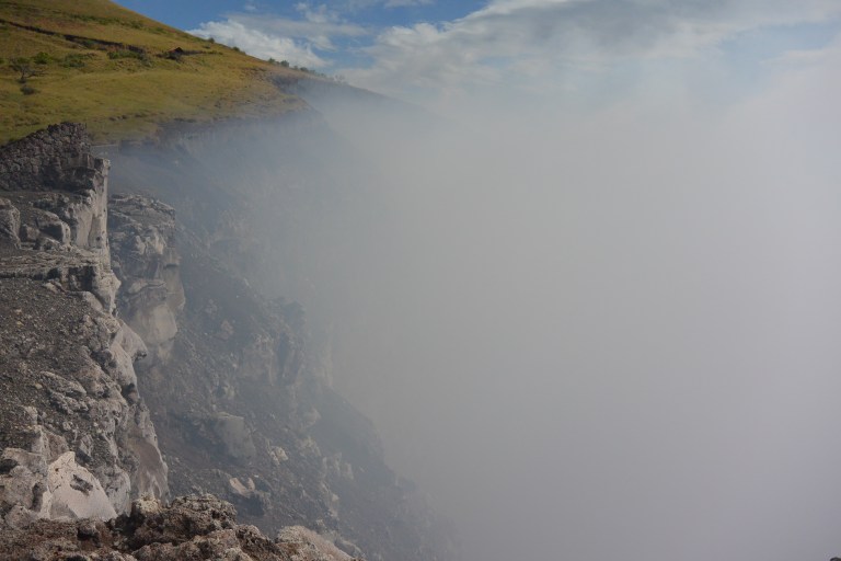 The steady wind could not drive away the dense, poisonous cloud hanging above the scorching crater
