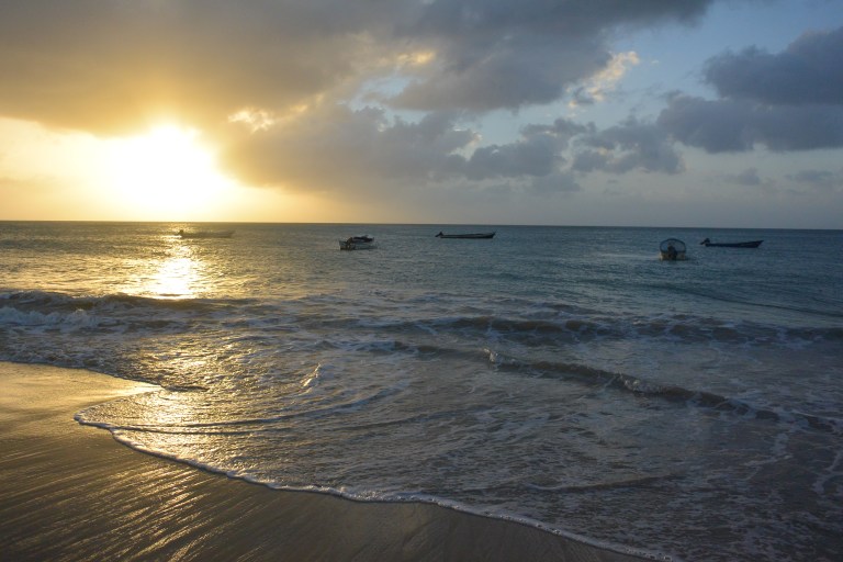 A circle of boats off Big Corn Island slowly drawing in a large fishing net